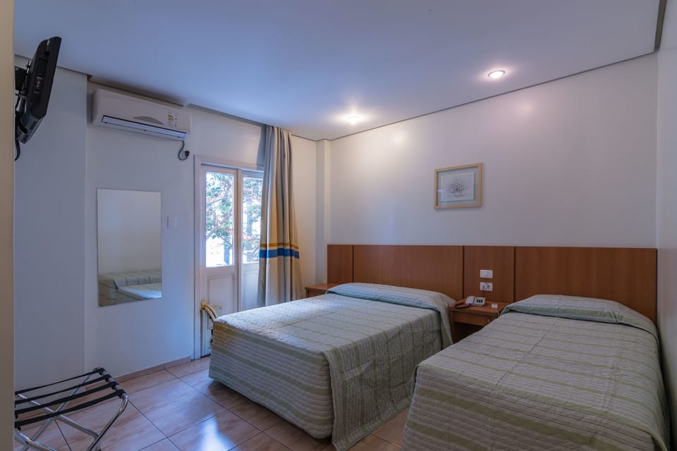 Standard Triple Room | Minibar, in-room safe, desk, laptop workspace