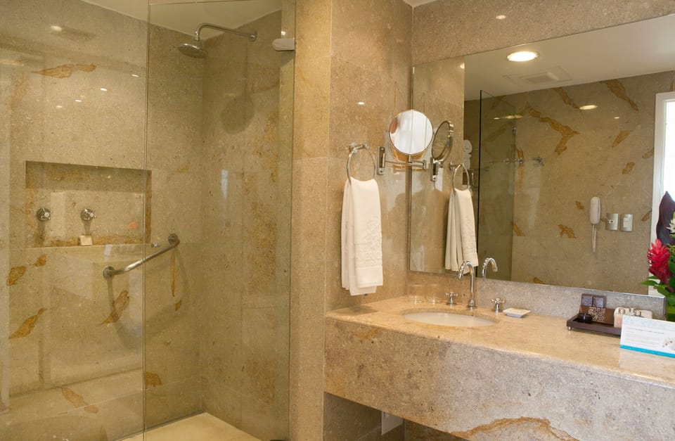 Shower, designer toiletries, hair dryer, bathrobes