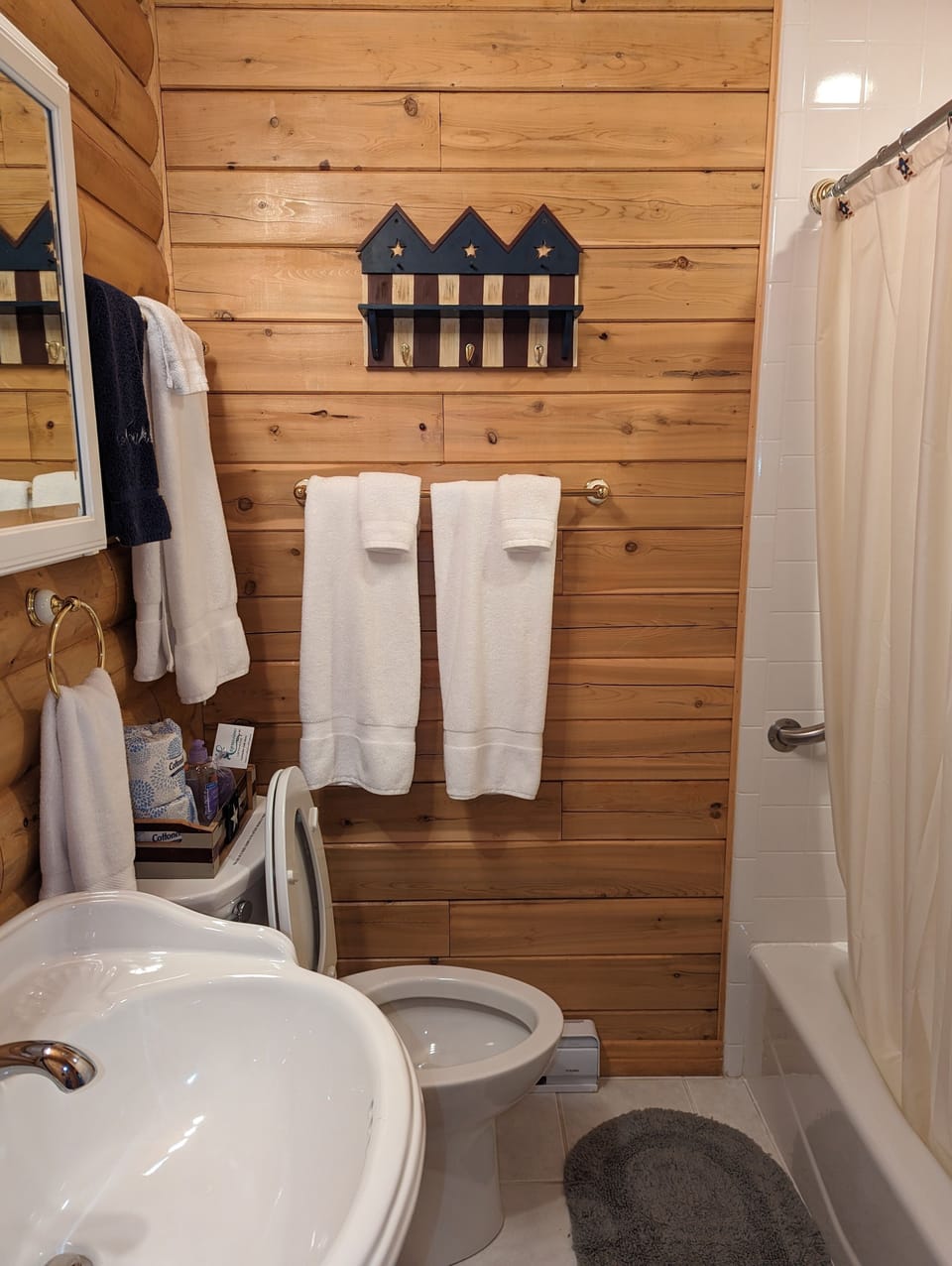 The full bathroom with a laundry closet