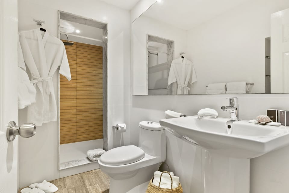 Family Suite, 2 Bedrooms, Lagoon View | Bathroom | Shower, free toiletries, hair dryer, towels