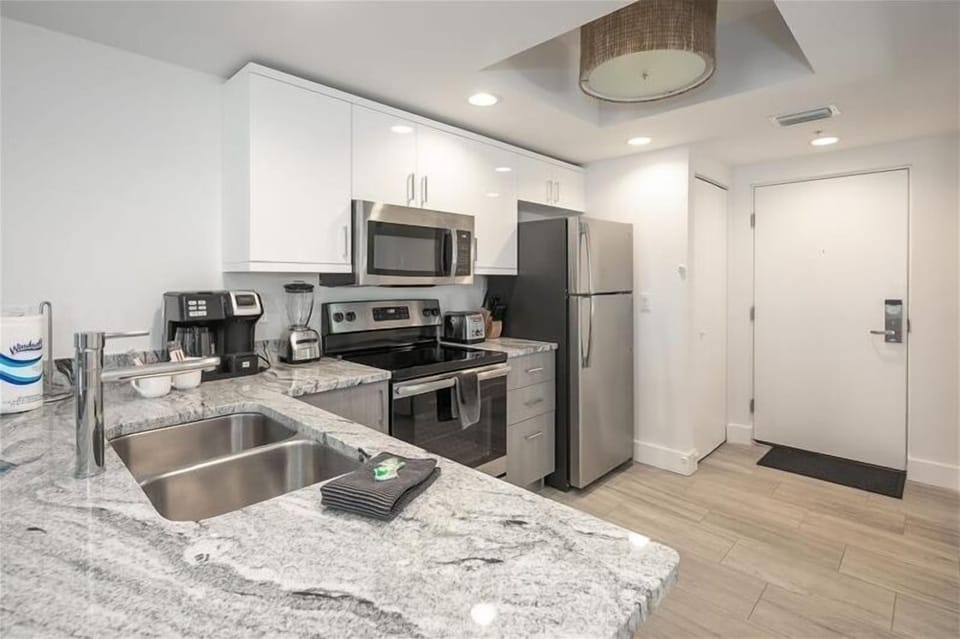 Kitchen with granite and stainless appliances