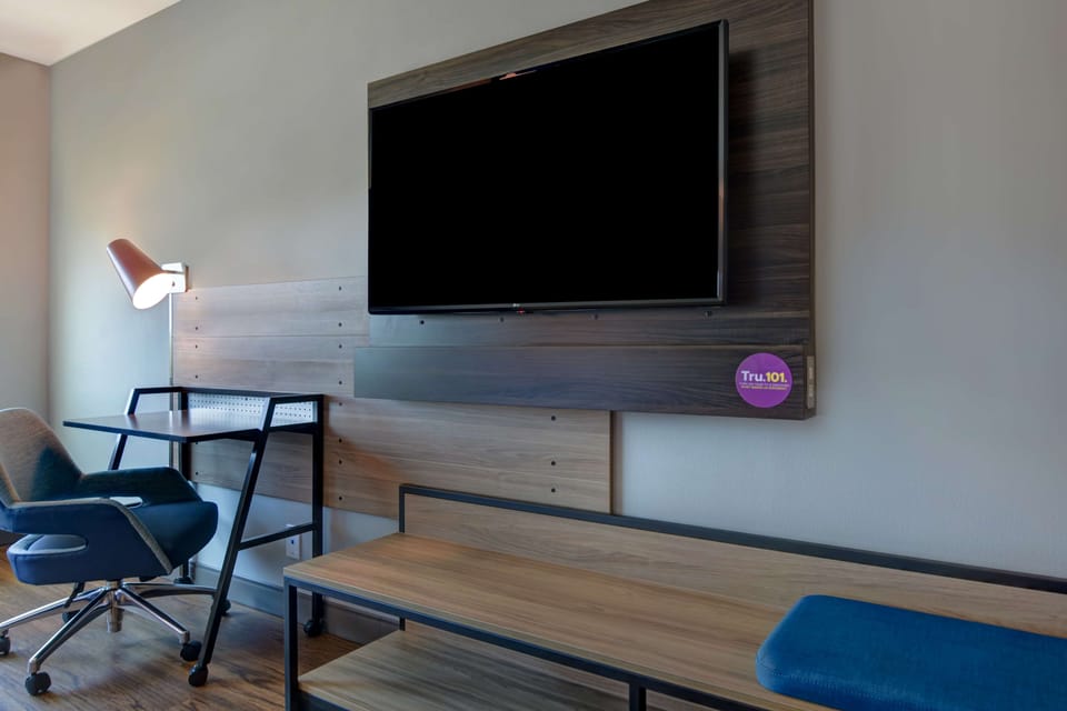 Desk, laptop workspace, blackout drapes, iron/ironing board