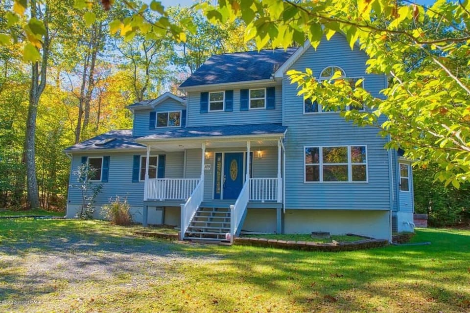 Front view showcasing charming exterior and scenic surroundings