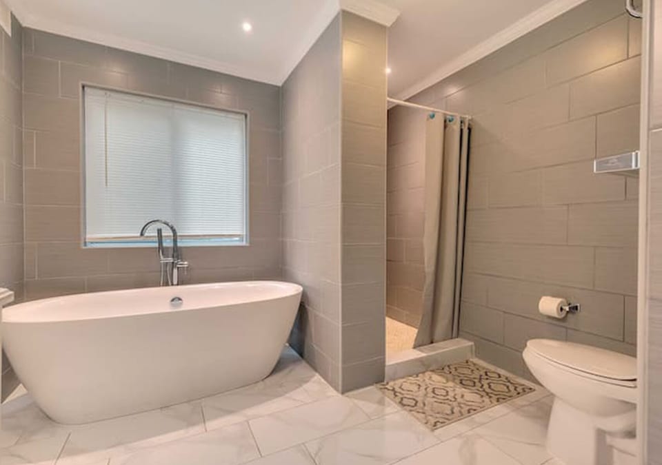 Relaxing bathroom featuring a luxurious bathtub