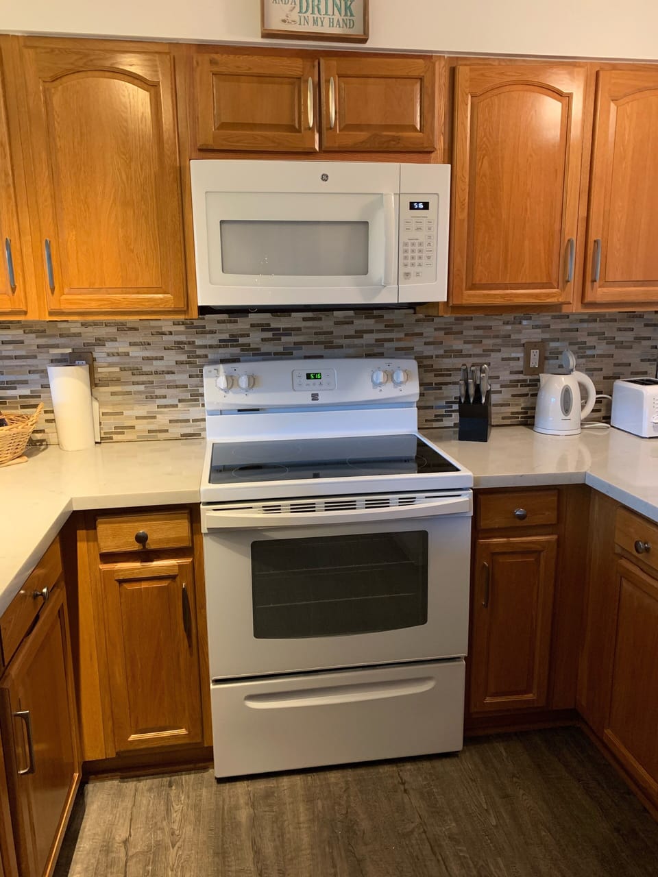 Fully stocked kitchen with standard size refrigerator.