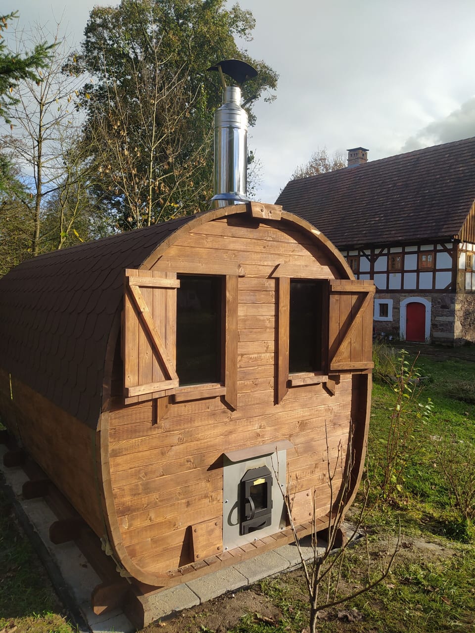 Sauna showing external wood stove