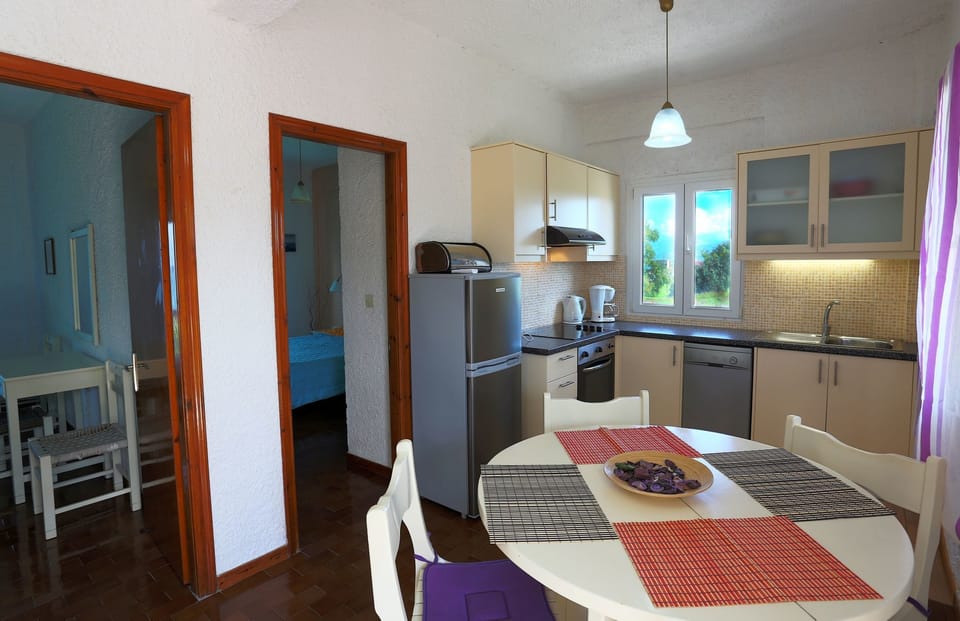 Apartment, 2 Bedrooms, Sea View | Private kitchen | Coffee/tea maker, full-size fridge, stovetop, dishwasher