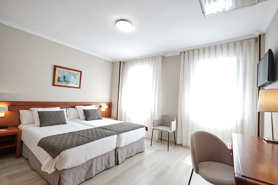 Standard Double or Twin Room, Private Bathroom | In-room safe, desk, laptop workspace, blackout drapes