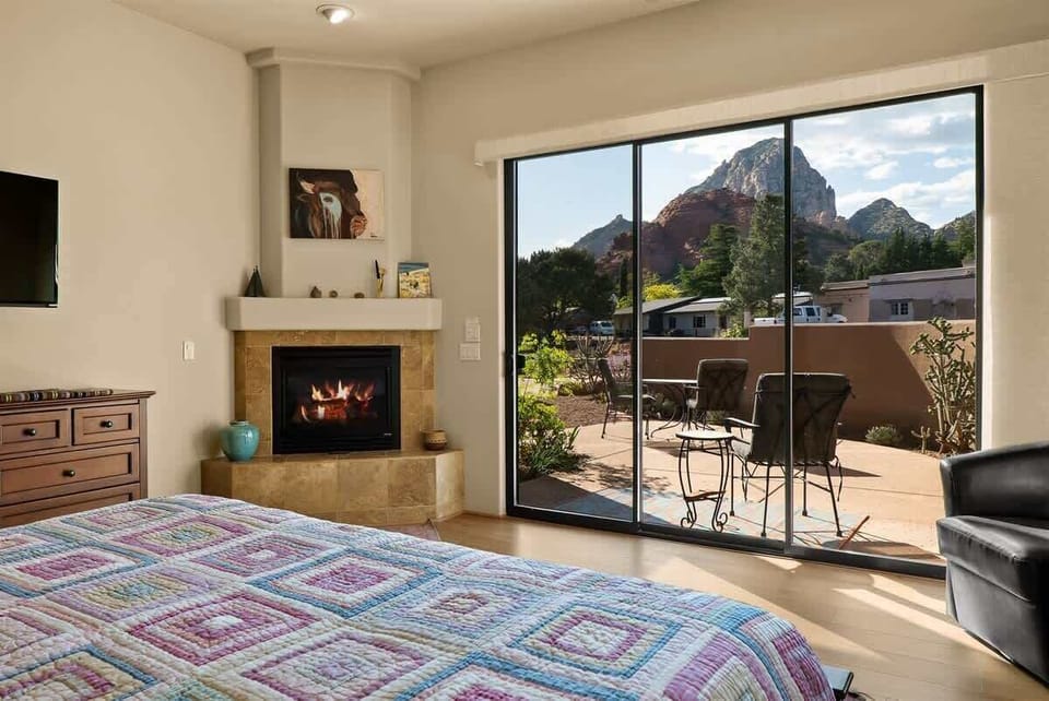 Doors out to front patio with red rock views