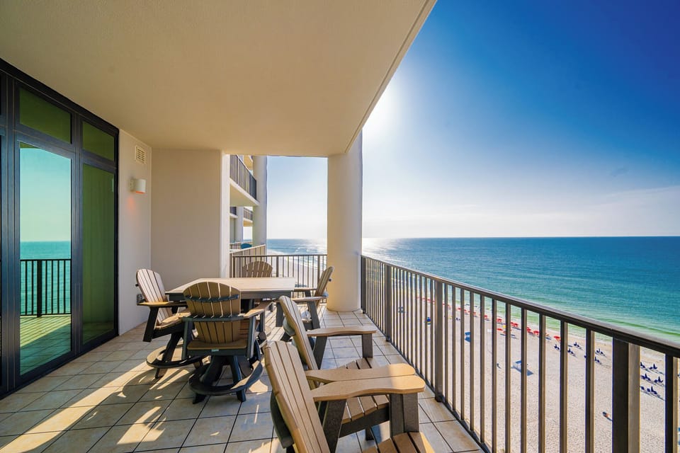 Enjoy breathtaking beachfront views from the spacious balcony, complete with comfortable seating for relaxation