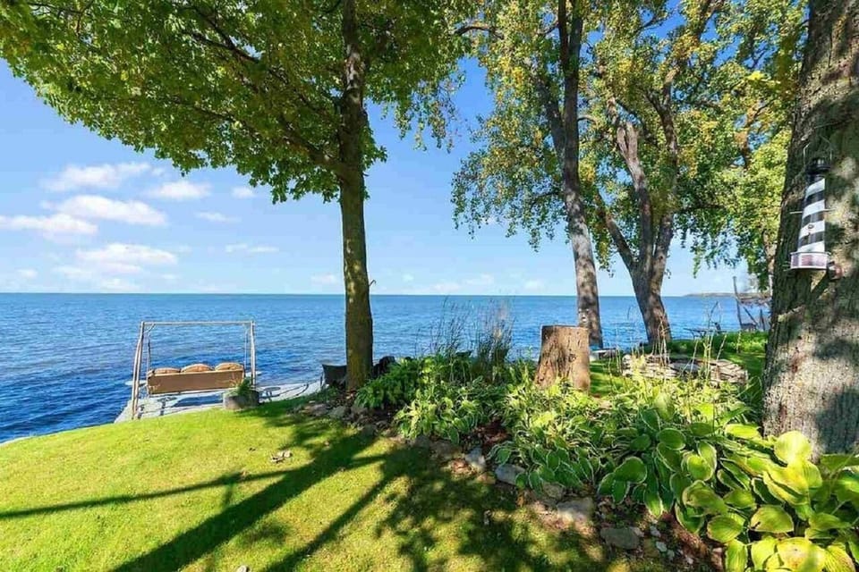 Grassy front and garden beds.
