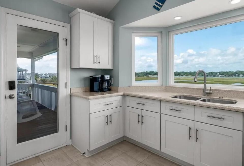 Drink your coffee on the back deck. Kitchen leads to back deck