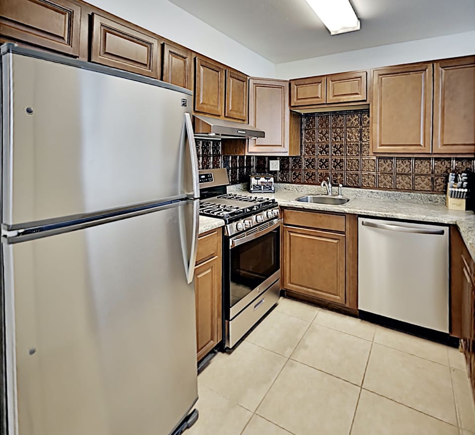 Enjoy a homecooked meal with everything you could need supplied in the condo kitchen.