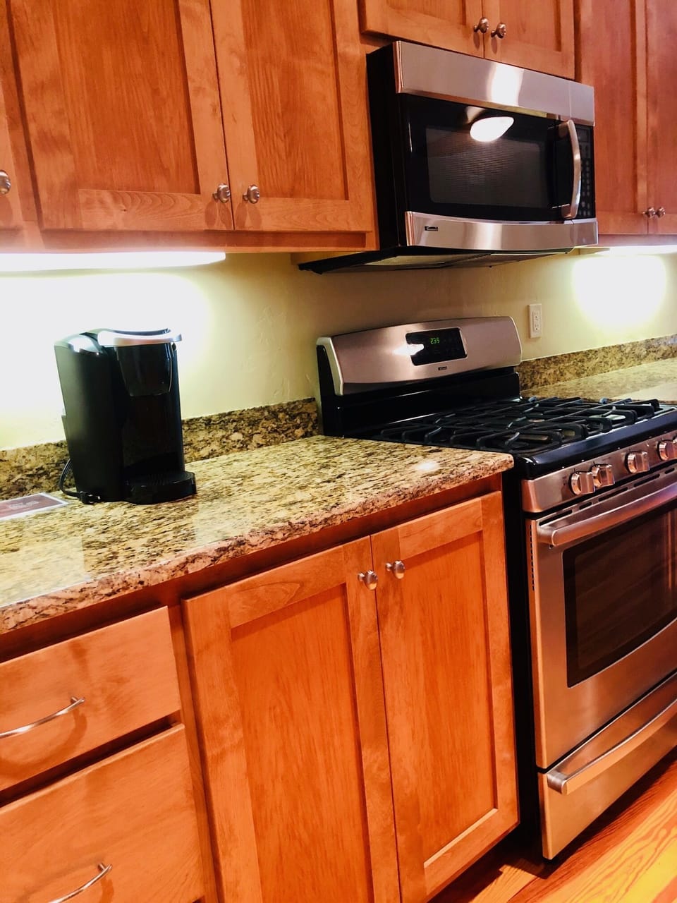Kitchen is completely stocked with pots, pans, glasses, and small appliances.