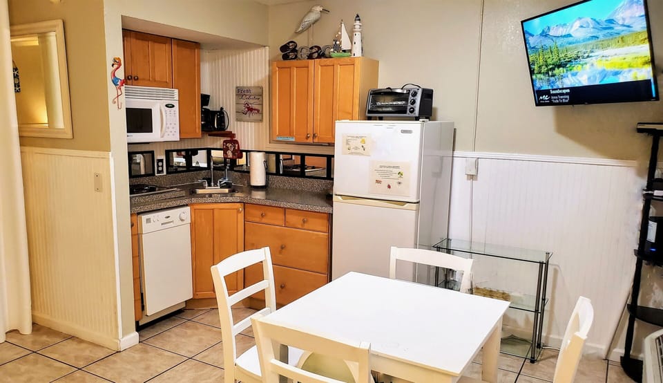 Standard size refrigerator/freezer, toaster oven. cabinets & drawers for storage