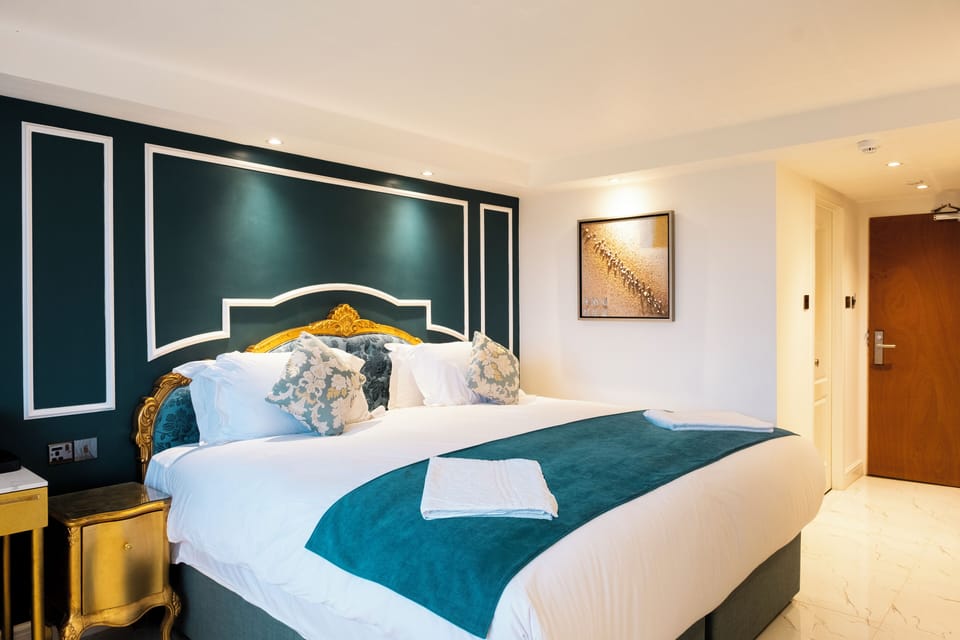 Executive Double Room | Desk, blackout drapes, iron/ironing board, free WiFi