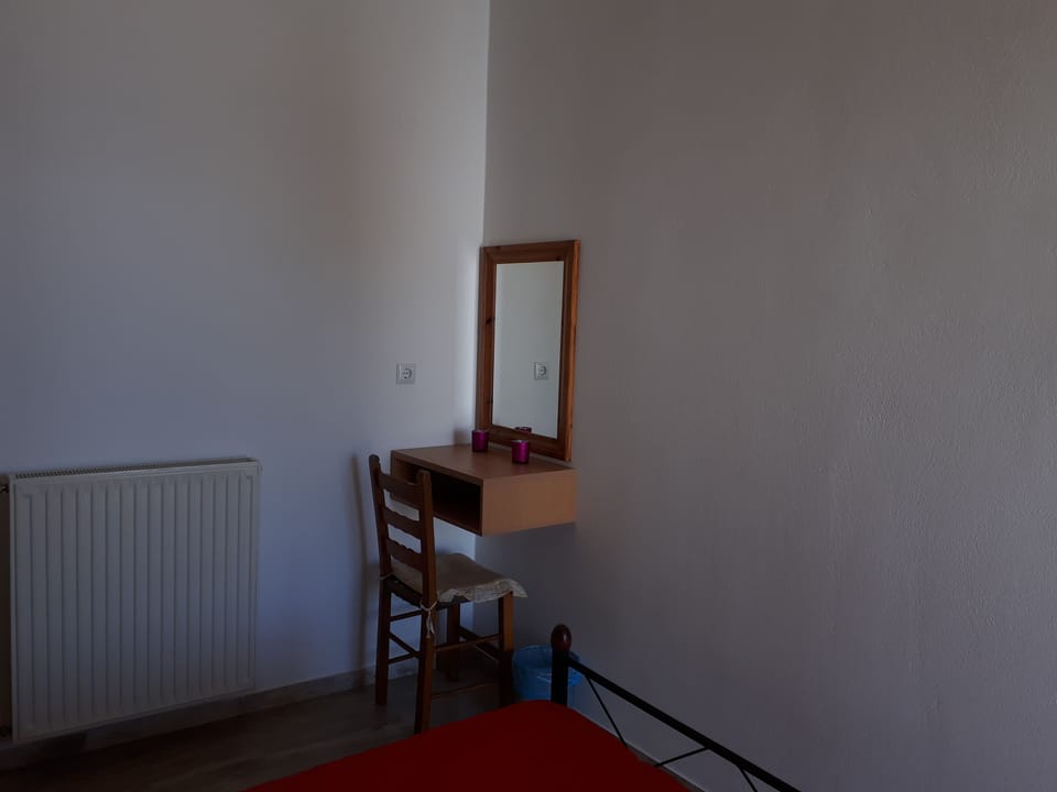 Apartment, 1 Bedroom, Sea View | 1 bedroom, individually decorated, iron/ironing board