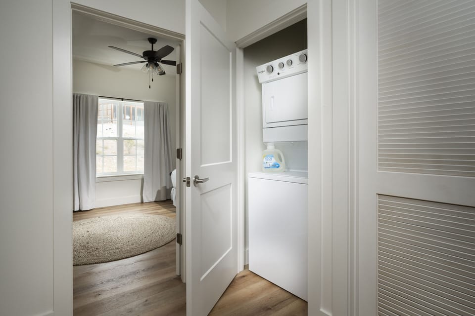 Stacked washer and dryer units on the top level.
