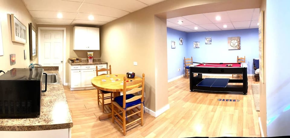 Newly renovated game room with 3 in 1 game table (pool, ping-pong, and air hockey!), card table, movie area with streaming tv for your Netflix or Amazon movies, and a snack bar area!