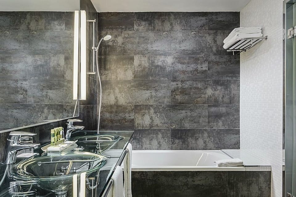Eco-friendly toiletries, hair dryer, bidet, towels