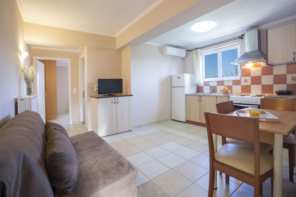 Family Apartment, 1 Bedroom | Living area | Flat-screen TV