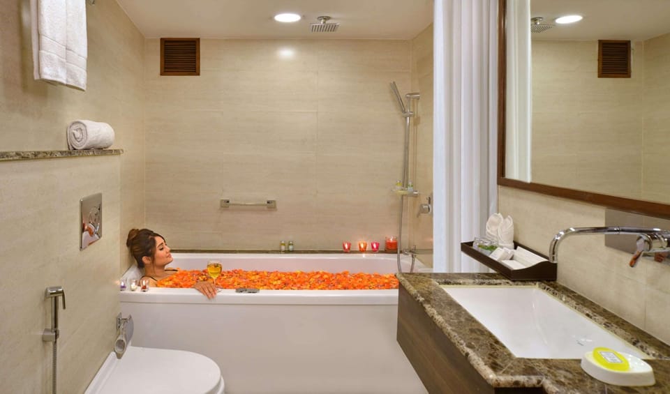 Shower, rainfall showerhead, designer toiletries, hair dryer