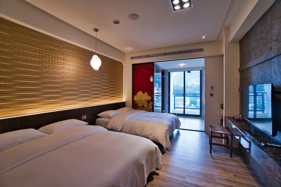 Family Twin Room | Minibar, blackout drapes, free WiFi, bed sheets