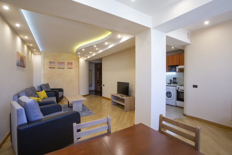 Panoramic Apartment, Balcony, Hill View | Living area | 41-inch flat-screen TV with digital channels, TV
