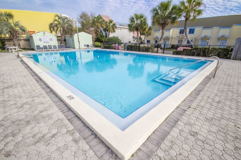 Full-Sized Pool and kiddie pool located 50 feet from the Condo!