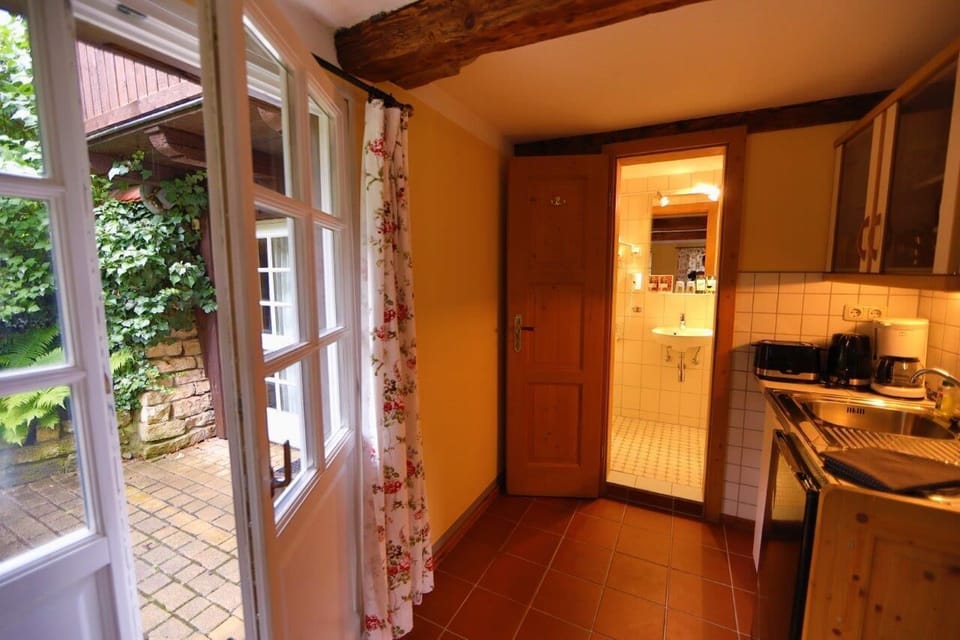 Double Room | Private kitchen | Mini-fridge, highchair