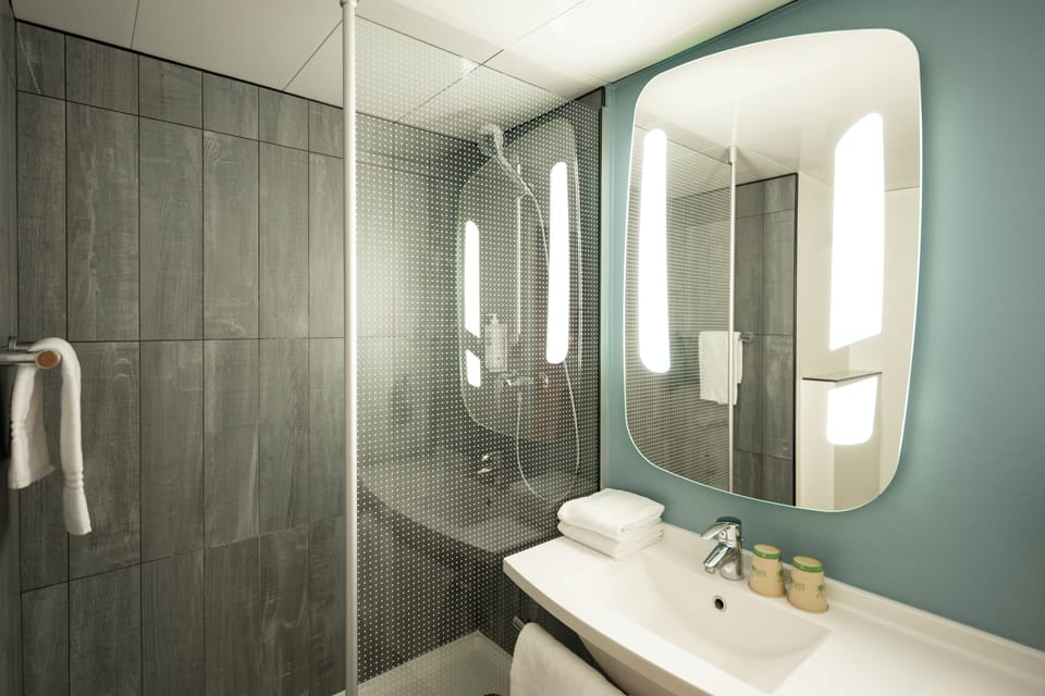 Shower, eco-friendly toiletries, hair dryer, towels