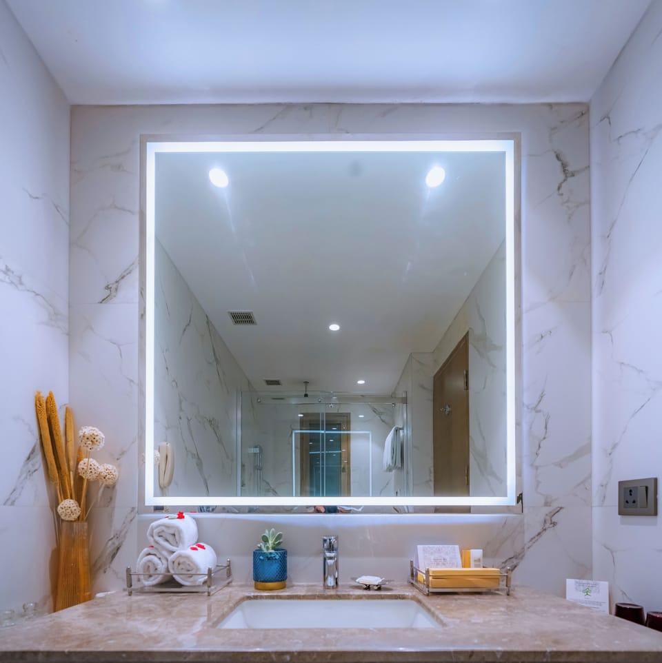 Shower, designer toiletries, hair dryer, bathrobes