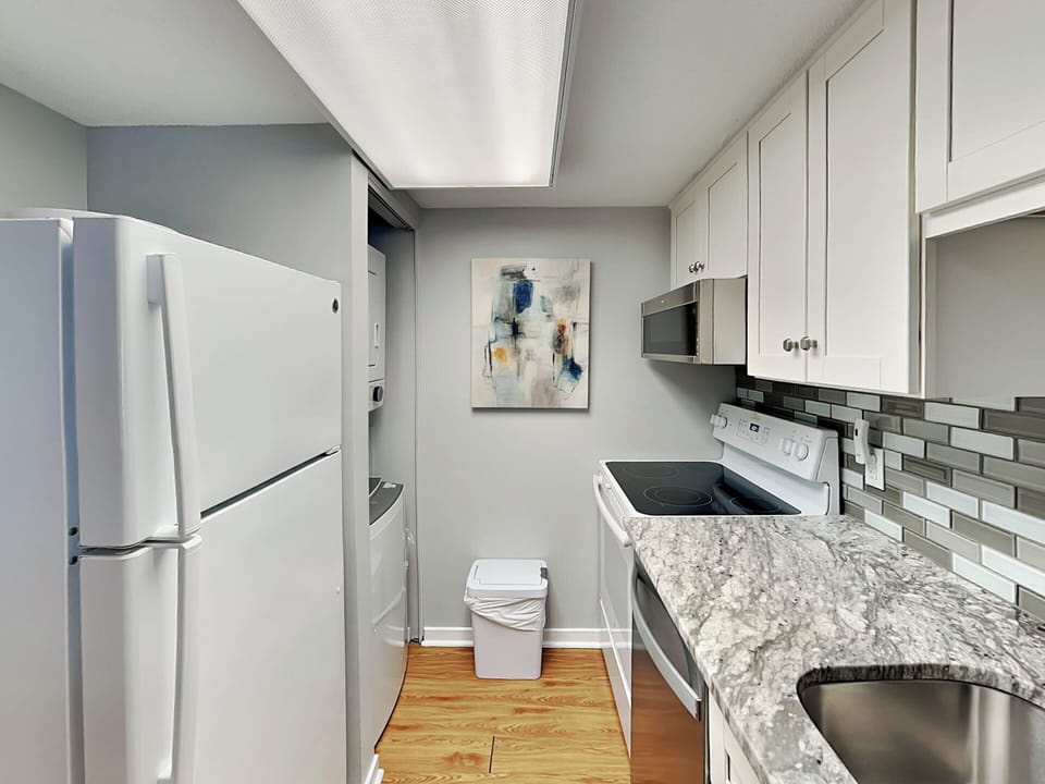 Condo, 1 King Bed with Sofa bed, Balcony, Garden View (Forest Beach Villa 306 - No Pets Allowed) | Private kitchen | Fridge, microwave, oven, stovetop