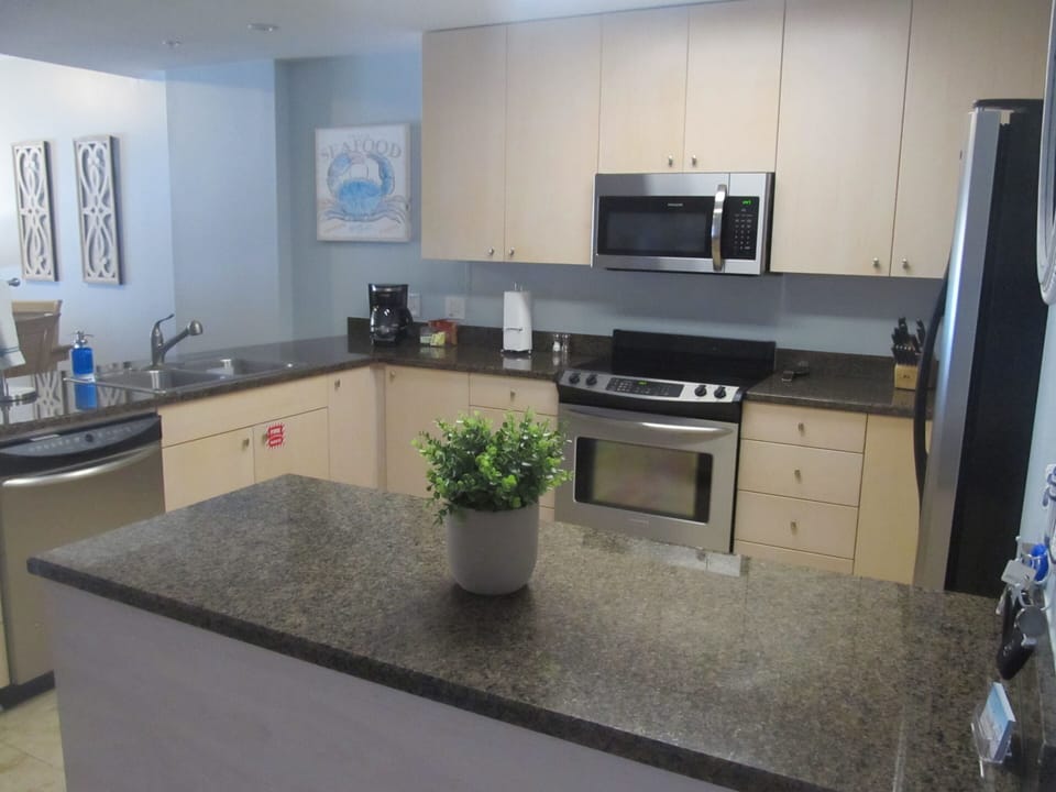 Our spacious kitchen has granite counter tops and stainless steel appliances.