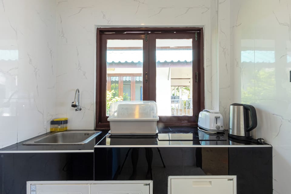 Bungalow, Beachfront | Minibar, WiFi (free), bed sheets