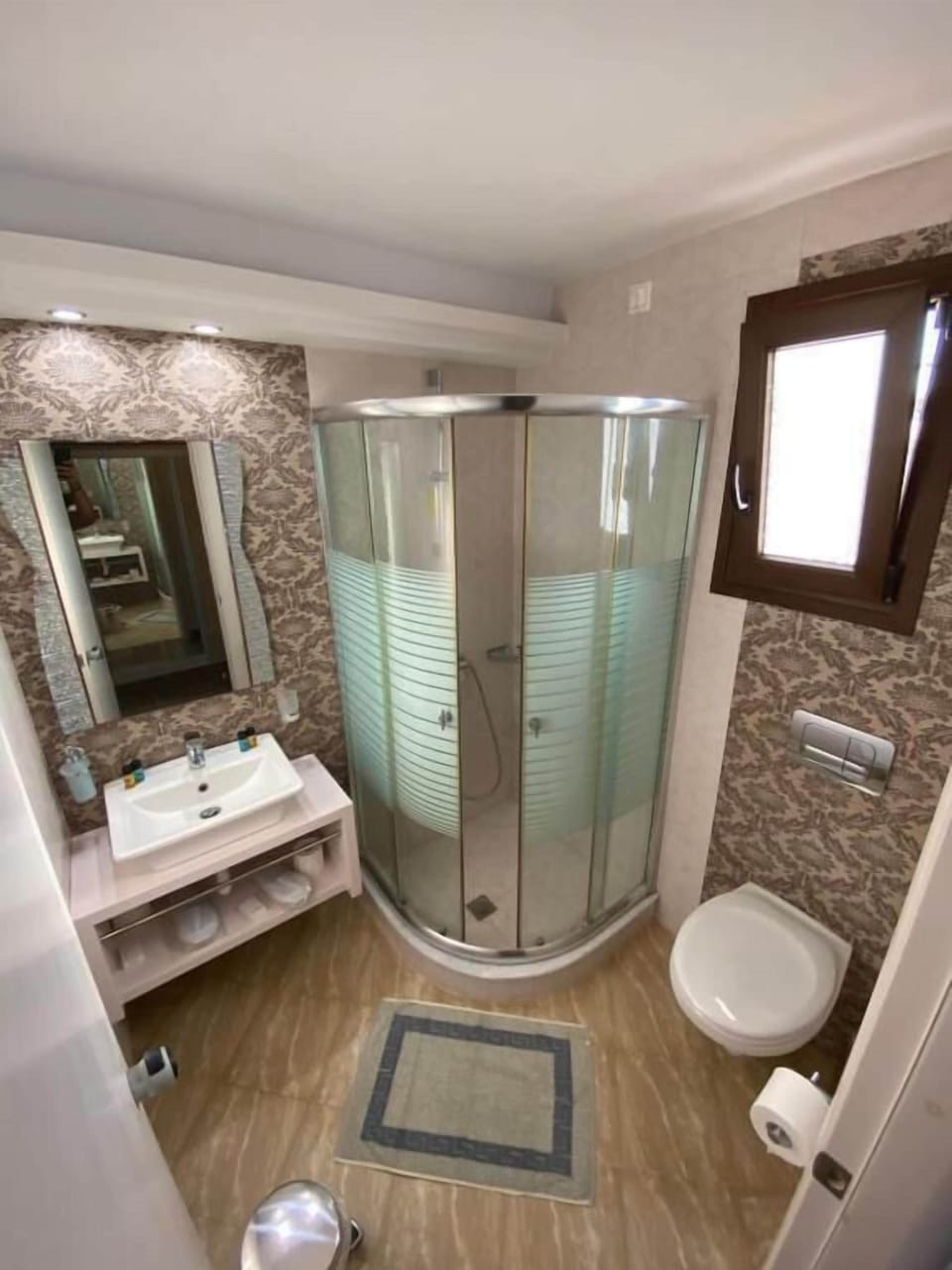 Shower, free toiletries, hair dryer, slippers