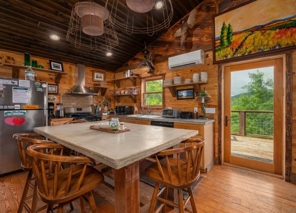 Share meals at the dining table situated conveniently next to the kitchen, fostering easy conversation and connection.