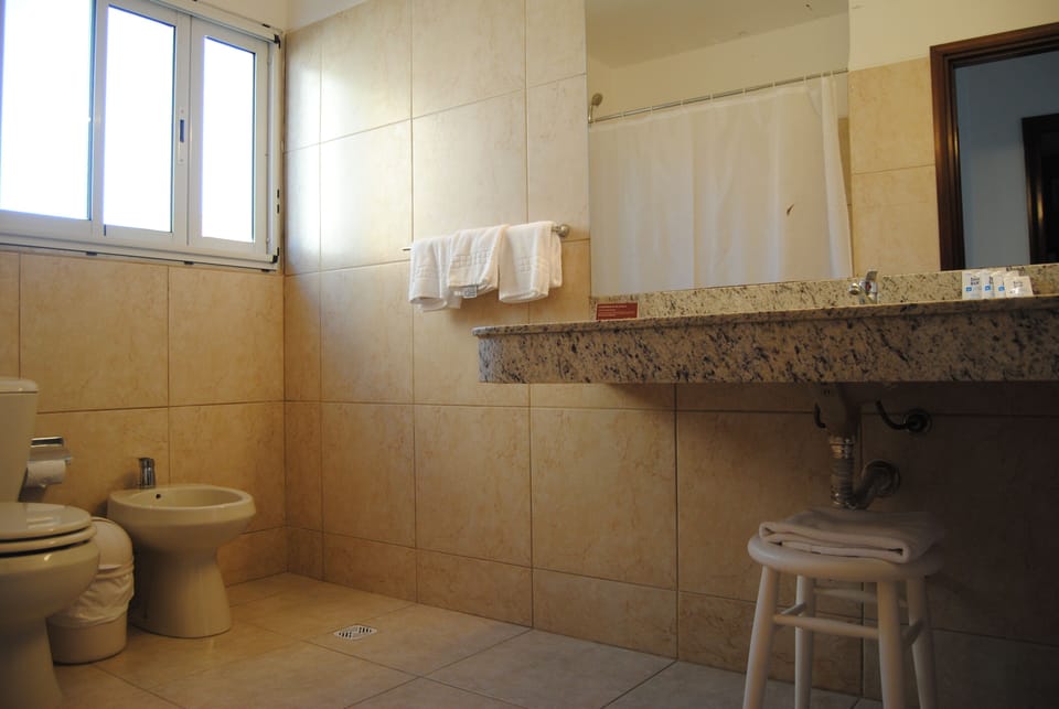 Family Quadruple Room | Bathroom | Rainfall showerhead, hair dryer, bidet, towels