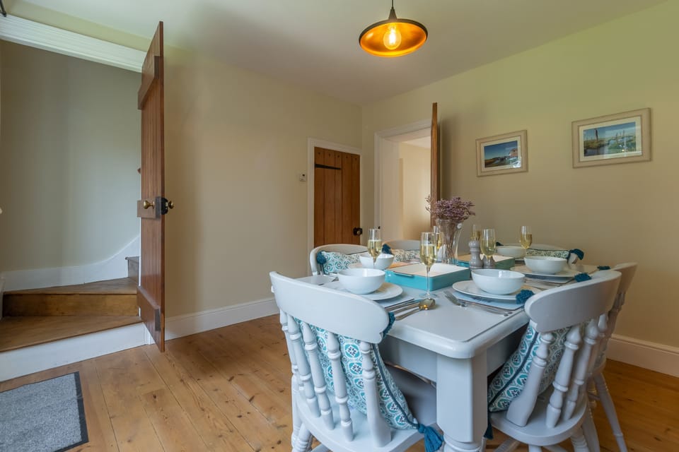 Ground floor: Dining room with stairs up to first floor