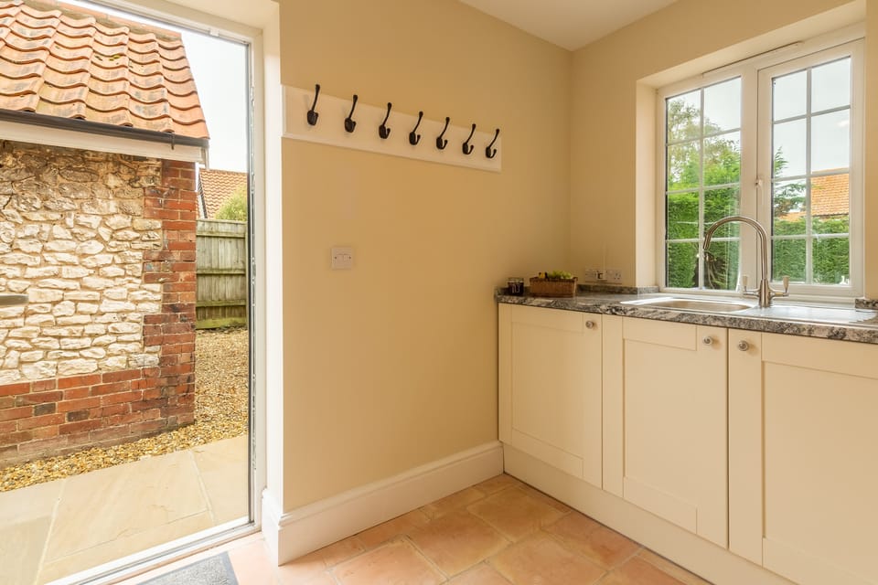 Ground floor: Utility room, with coat hook and door to rear garden