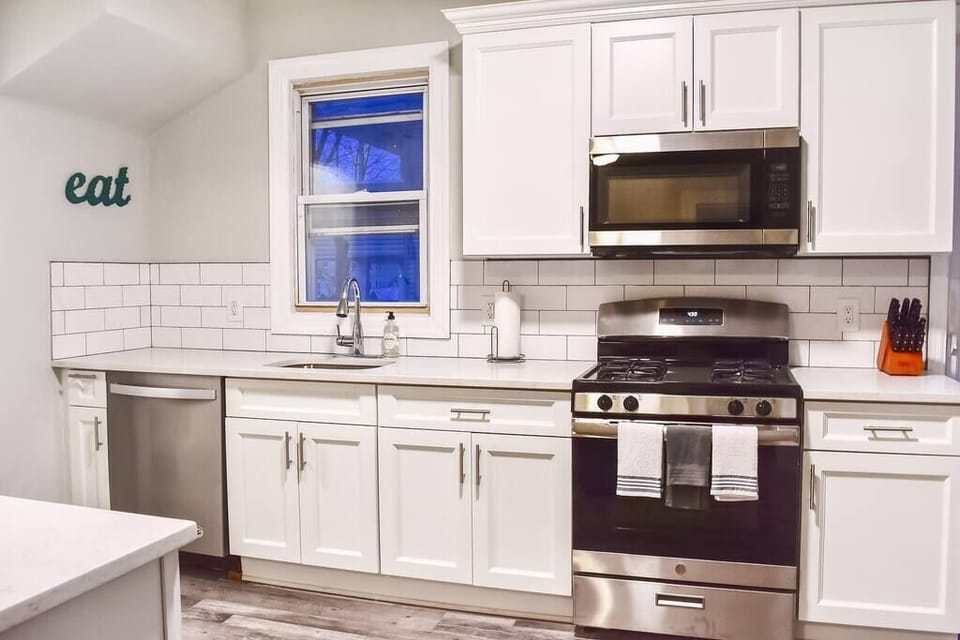 Our huge, chef's kitchen with brand new appliances, cabinets, dishes, pots, pans, and more