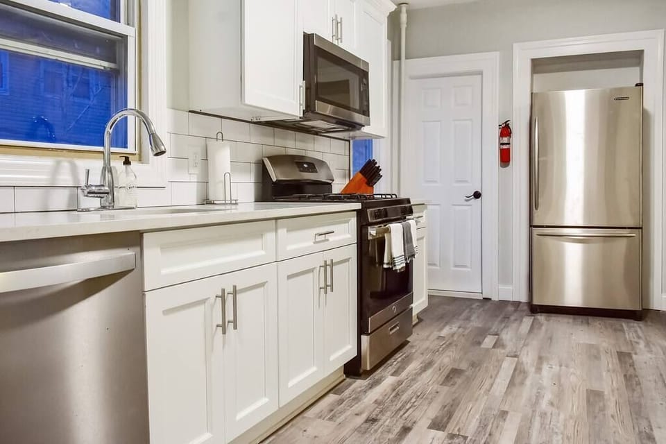 Our huge, chef's kitchen with brand new appliances, cabinets, dishes, pots, pans, and more