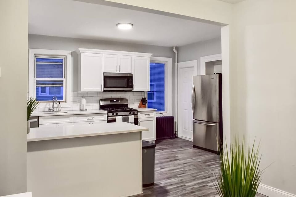 Our huge, chef's kitchen with brand new appliances, cabinets, dishes, pots, pans, and more