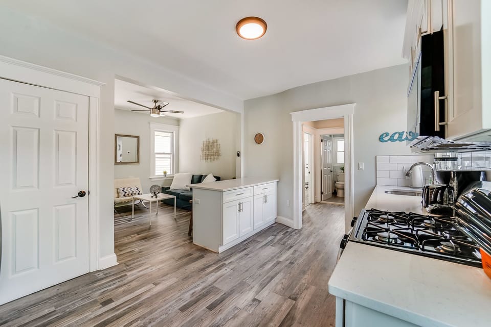 Kitchen with island open to Living Room