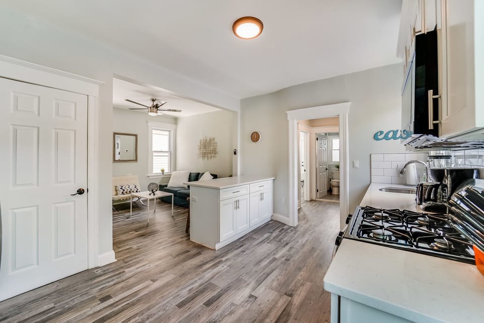 Kitchen with island open to Living Room