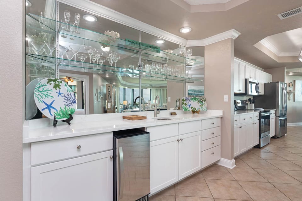 Grab a chilled drink from the fridge or create your favorite cocktail at the wet bar