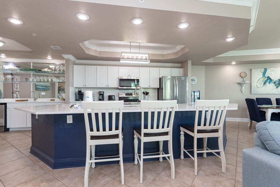 Gather with friends at the charming breakfast bar, sipping coffee while sharing laughter and stories