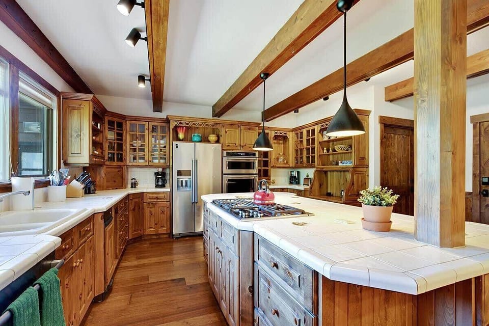 Fully stocked kitchen with large island and stainless steel appliances