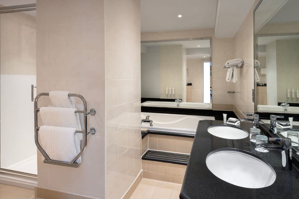 Suite, 1 Bedroom | Bathroom | Combined shower/tub, designer toiletries, hair dryer, towels