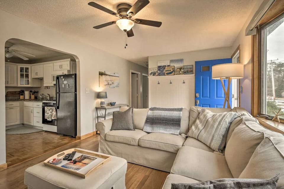 Living room, looking to kitchen and hall
